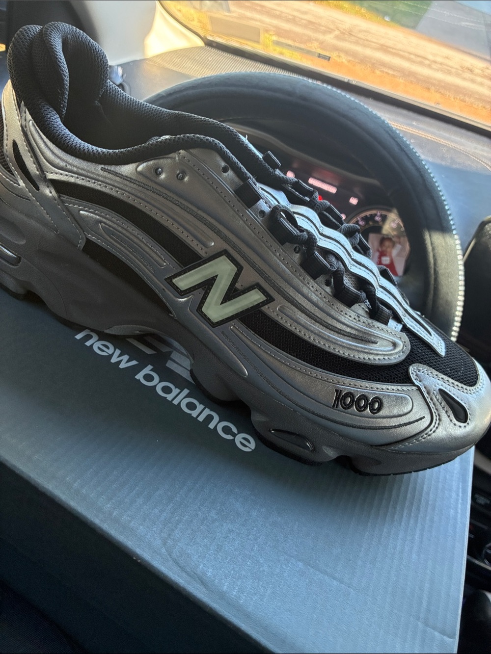 New Balance Men’s 1000 Sneaker in Metallic Silver and Black